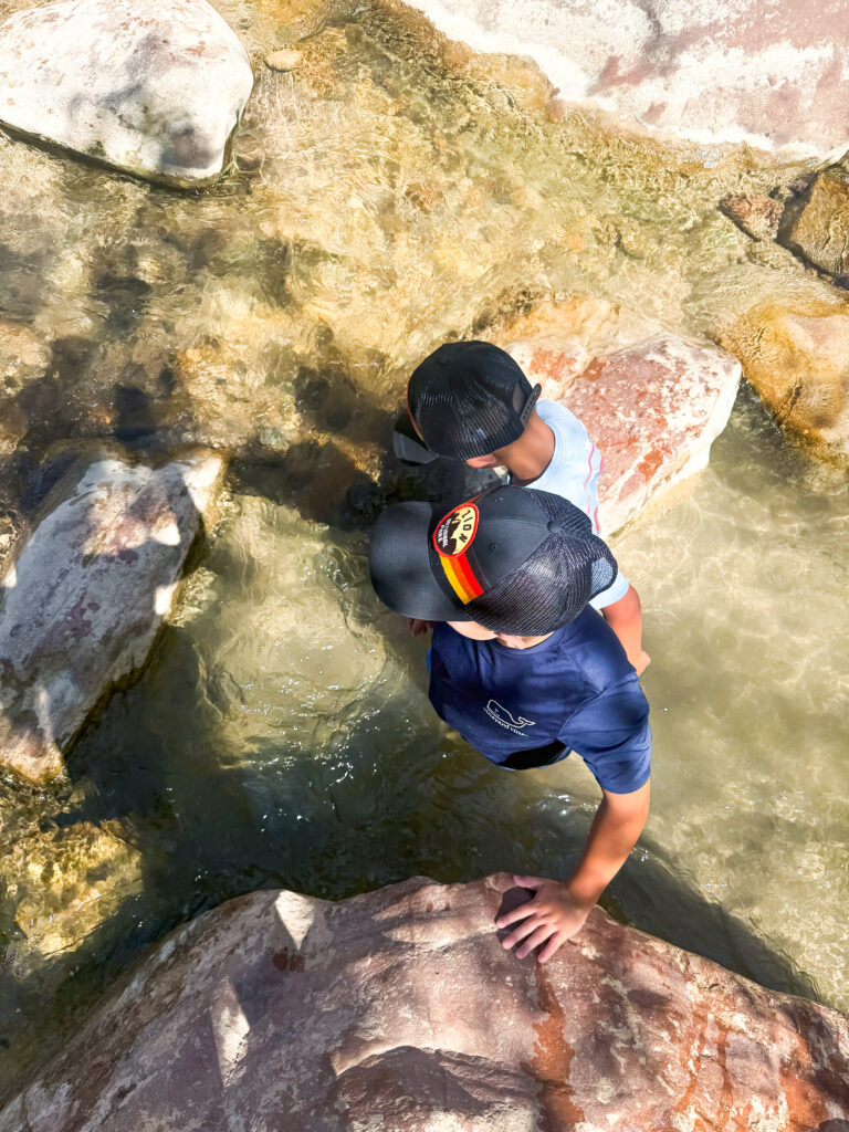 Young boys in water of Emerald Pools Trails in Zion