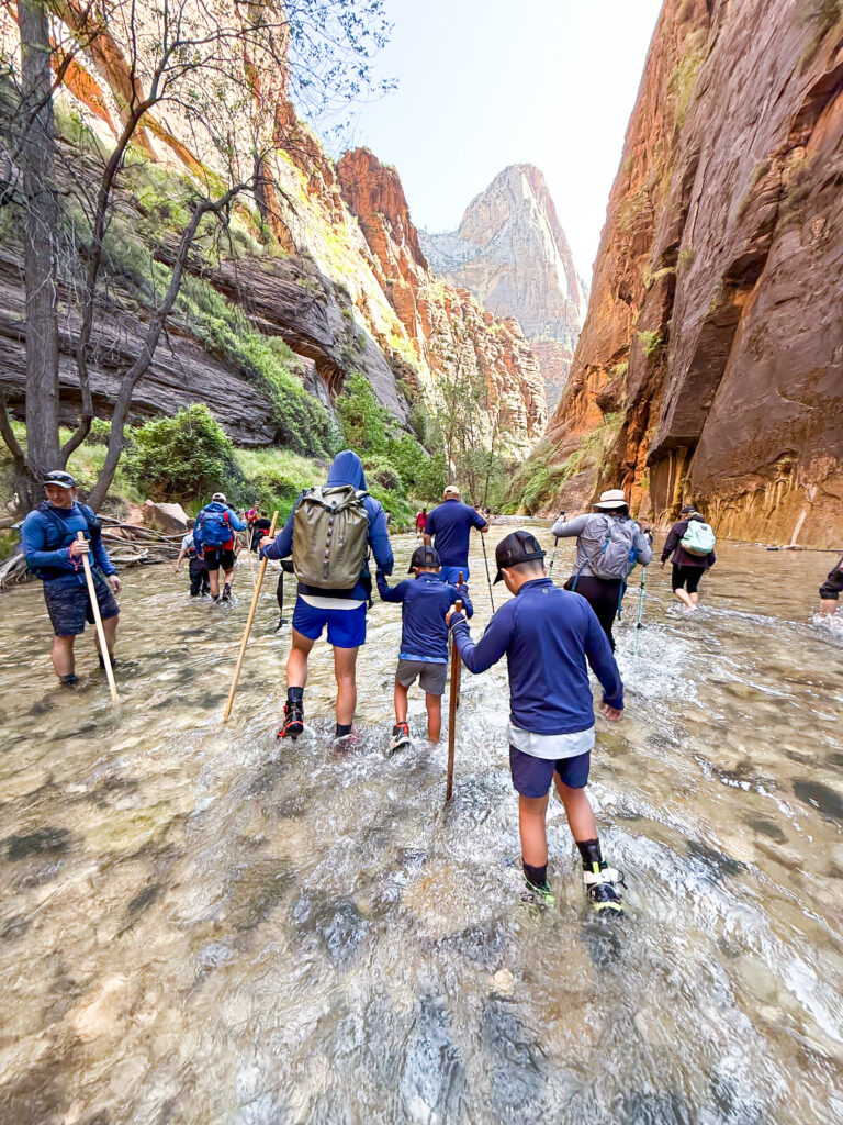 People hiking in the Narrows at Zion