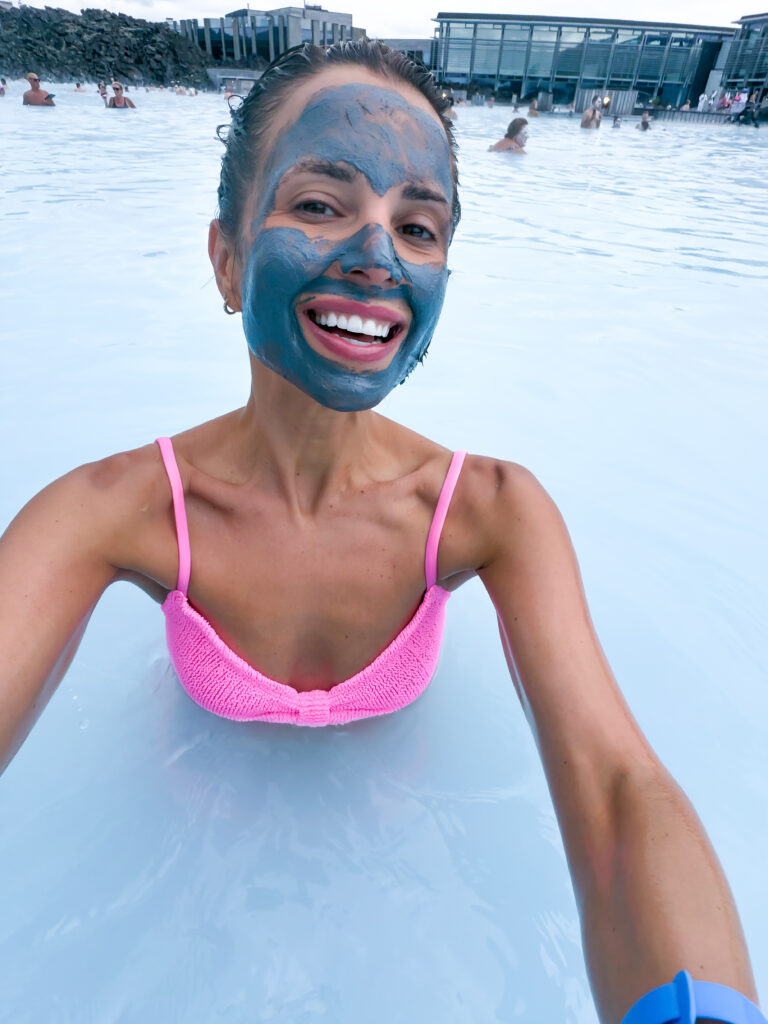 Woman with mud mask on face at the Blue Lagoon in Europe
