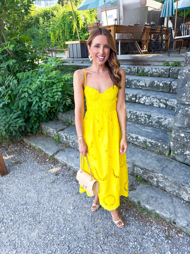 Woman in yellow midi dress for dinner at Portofino in Zurich