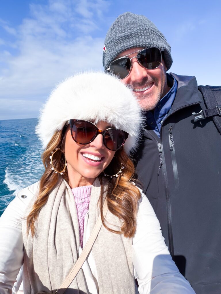 Couple smiling on whale watching tour  in Europe